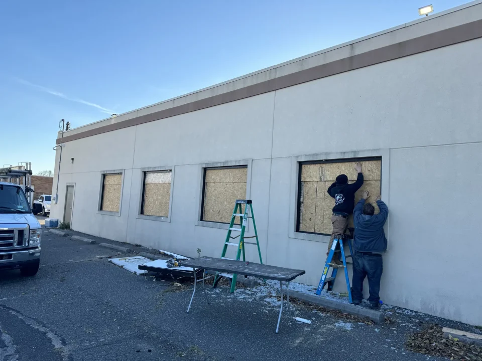 storefront glass pane installation in progress