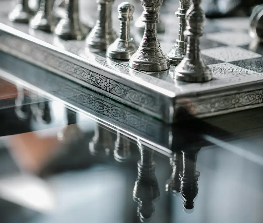 tempered glass table with chess board on top